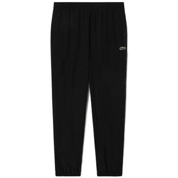 Pantalon Lacoste PANTALON DE SURVÊTEMENT EN TISSU DÉPERLANT NOIR